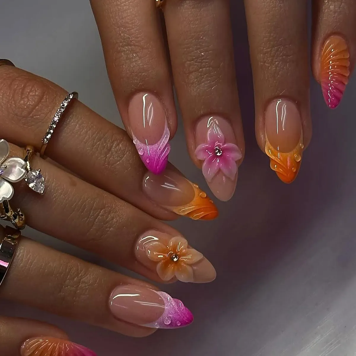 Pink and orange gradient tips with 3D flowers