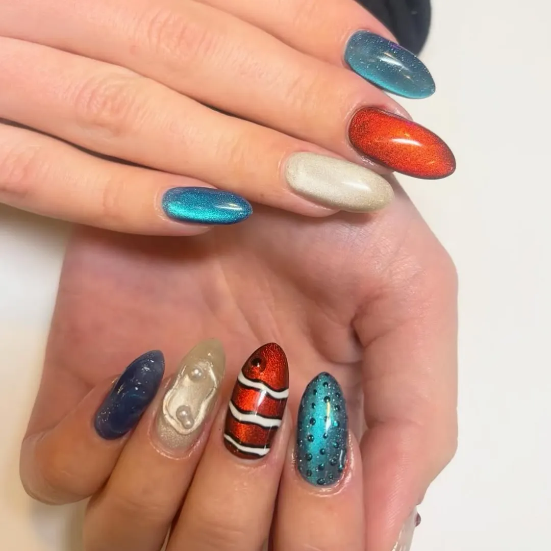 Mint chrome stiletto tips with 3D flowers and droplets