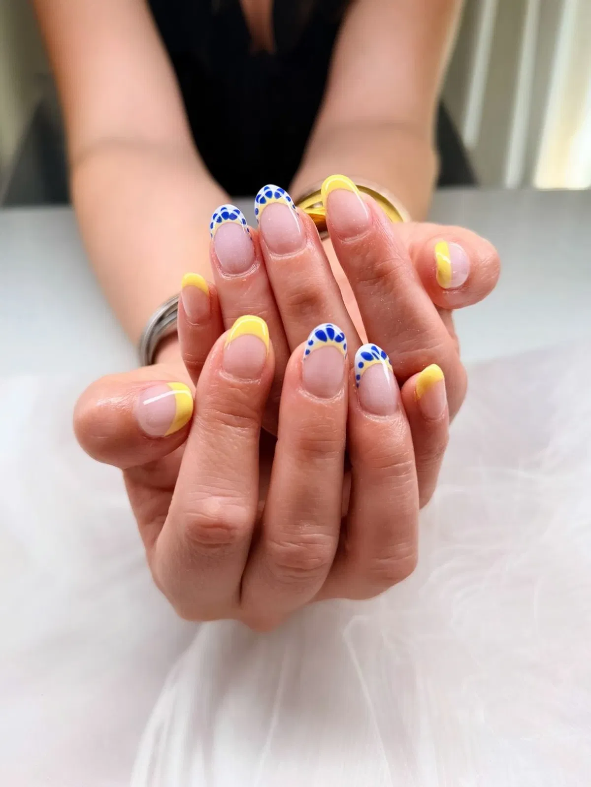 Yellow French tips with blue scalloped detail