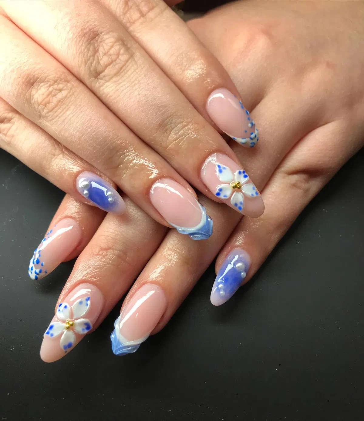 Blue French tips with 3D flower and glossy bead accents