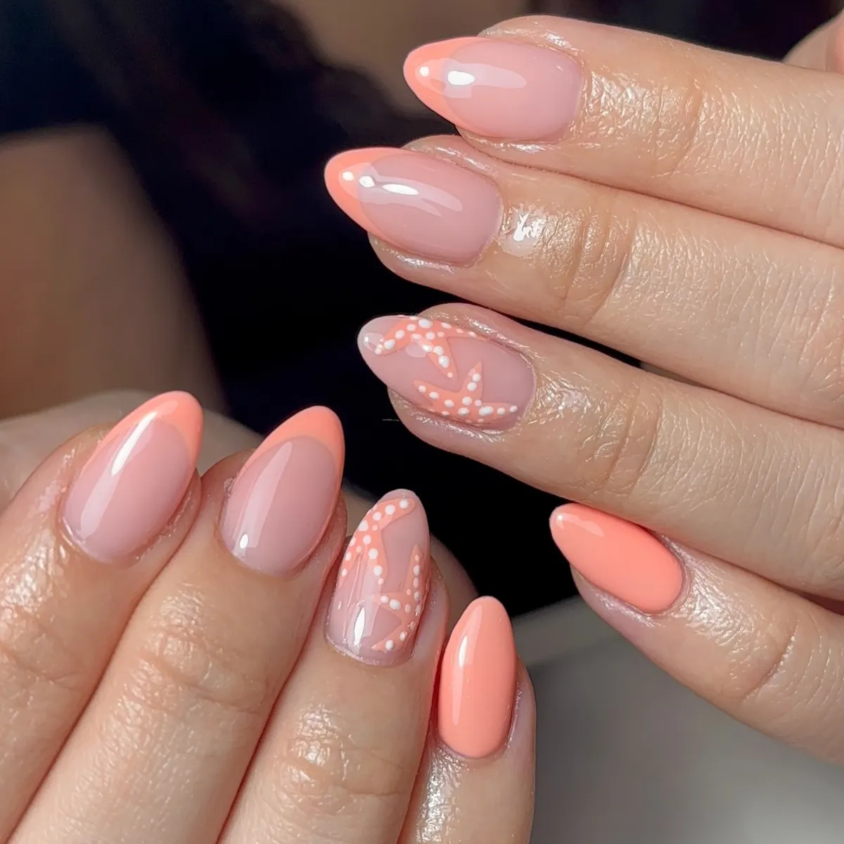 Peach-coral French with dotted starfish accents