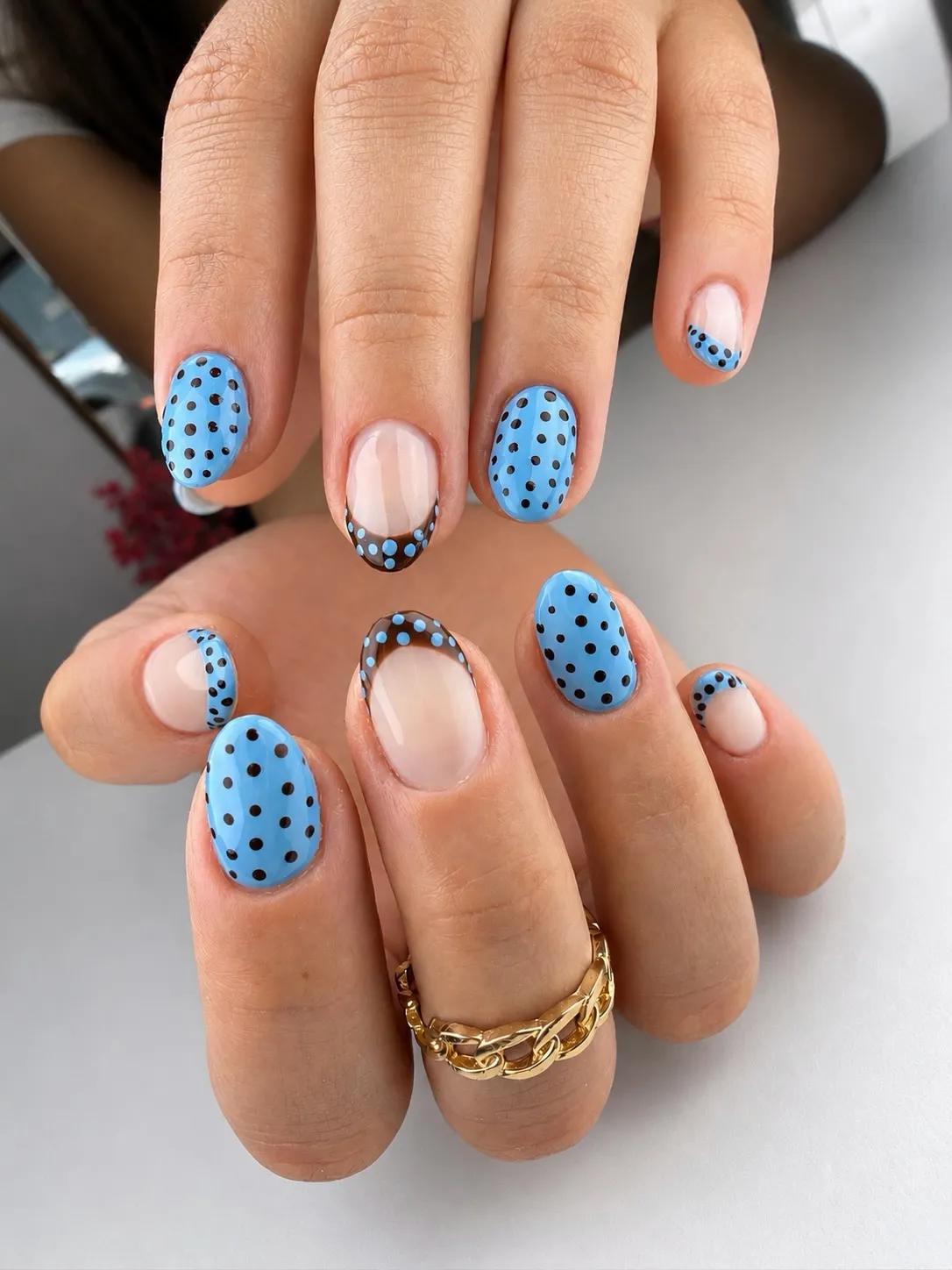 Light-blue polka dots with curved French detail