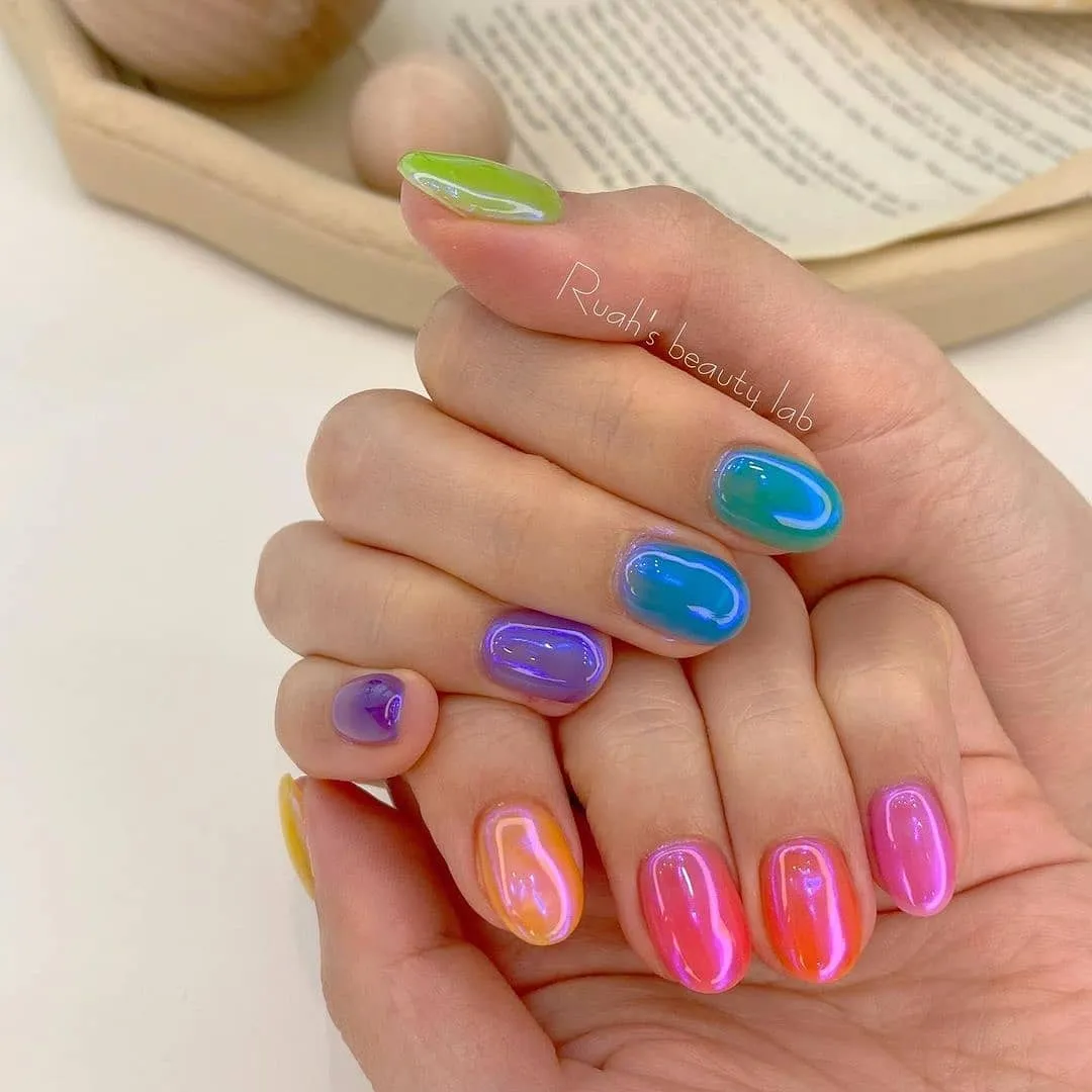 Glossy multicolor translucent nails with bright edge outlines