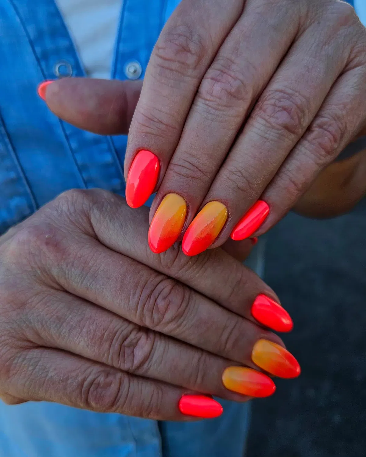Neon coral solids with warm sunset ombre nails