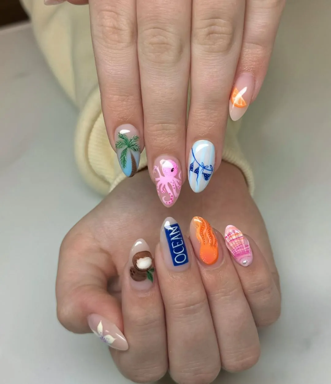 Ocean-themed mix with text, palm, octopus, and blue line art