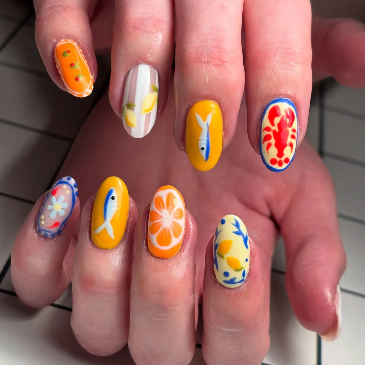 Mixed seaside motifs with citrus and bold red accent