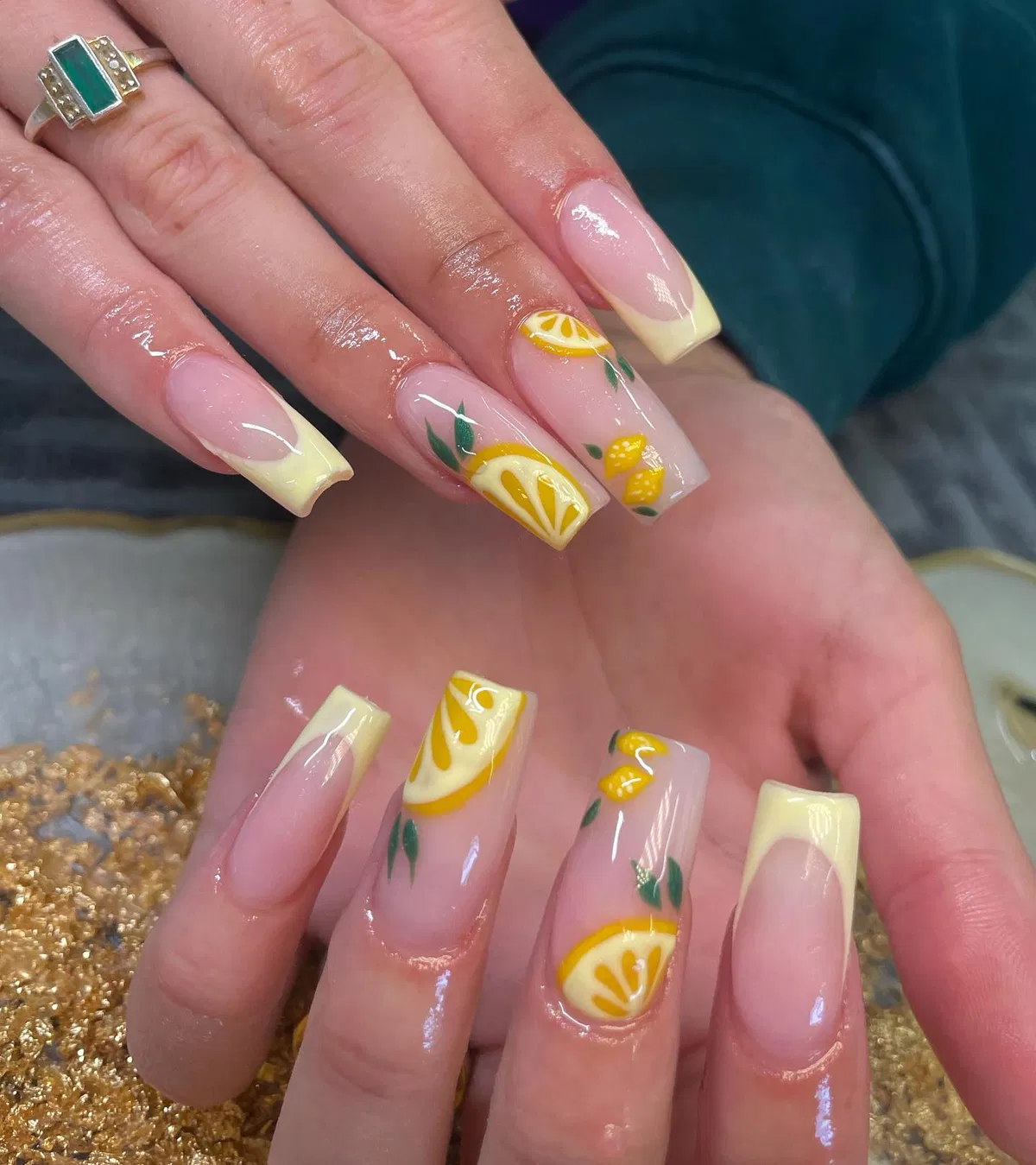 Long square pale-yellow French tips with lemon art