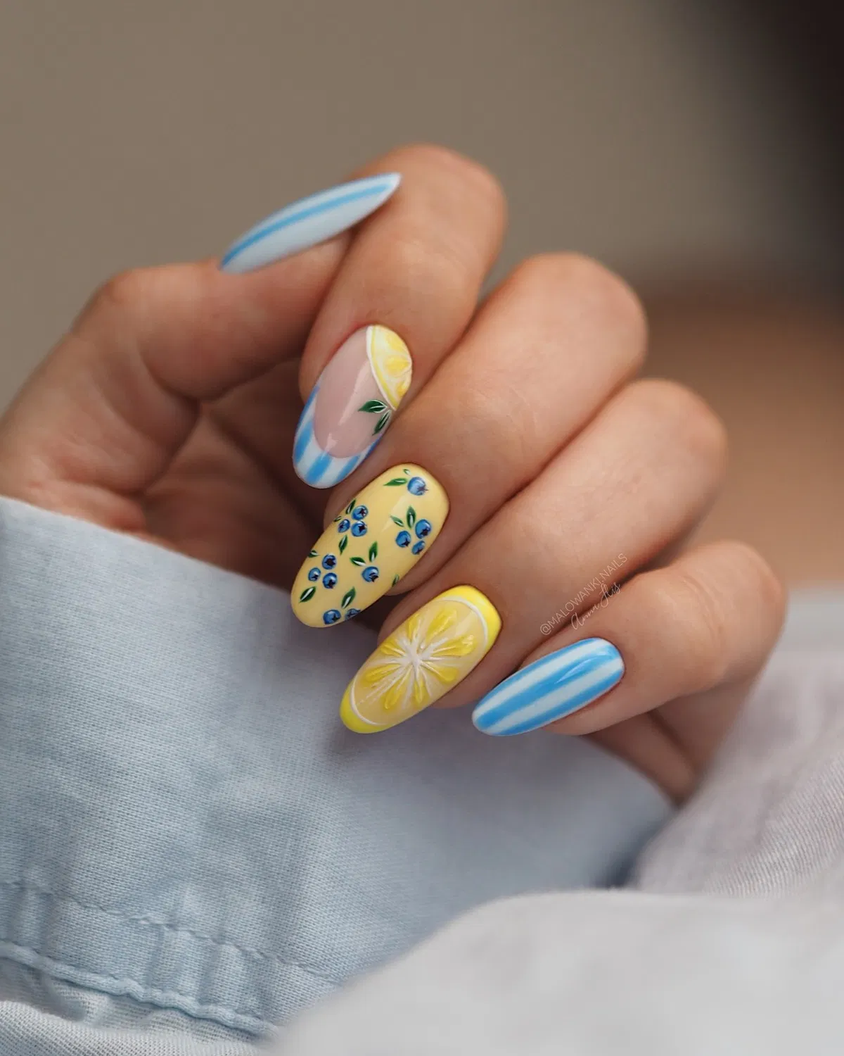 Blue stripes, berry-like dots, and a bold citrus slice