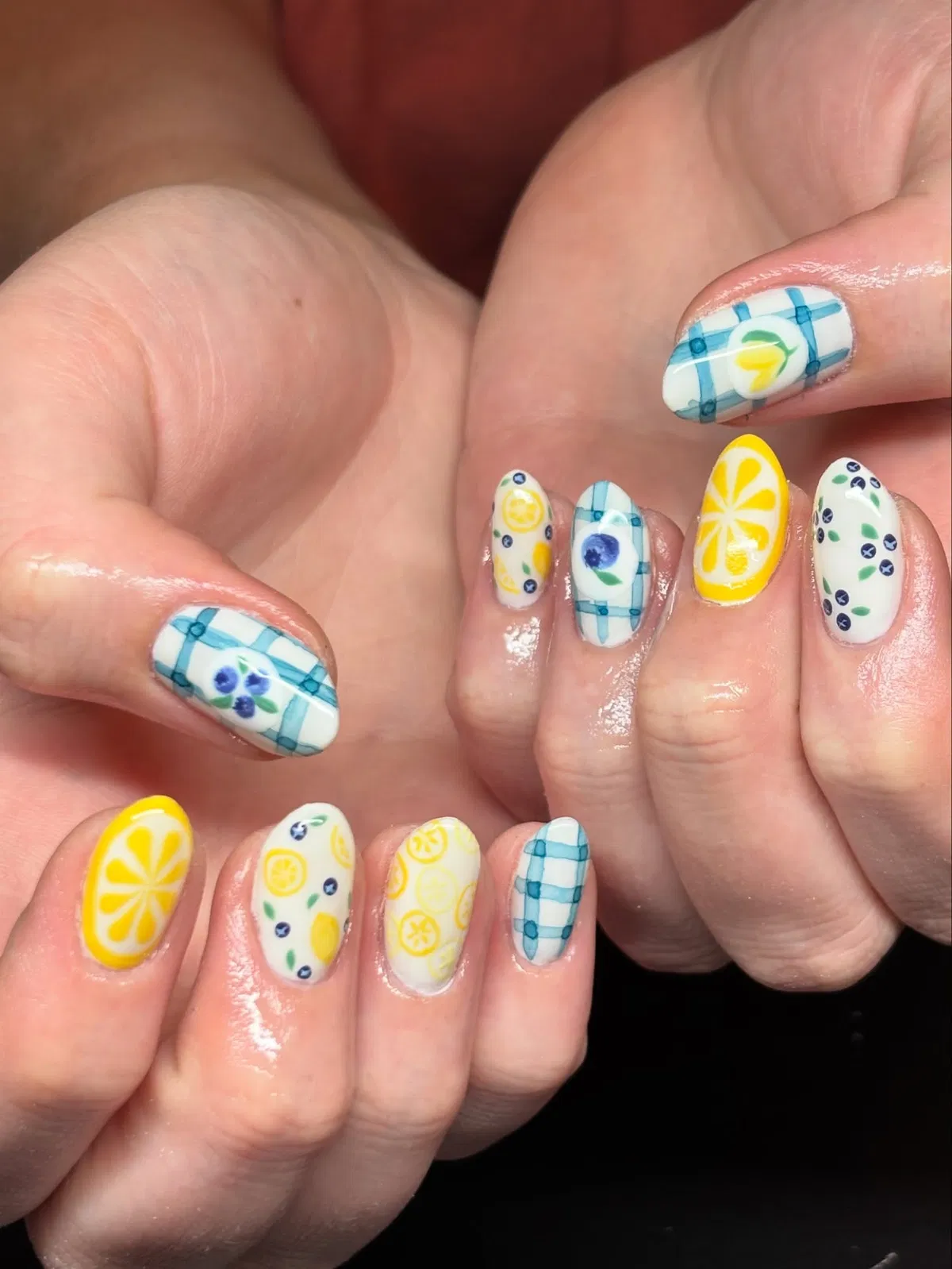 Mixed fruit set with blue checks, lemon slices, and berry-like dots