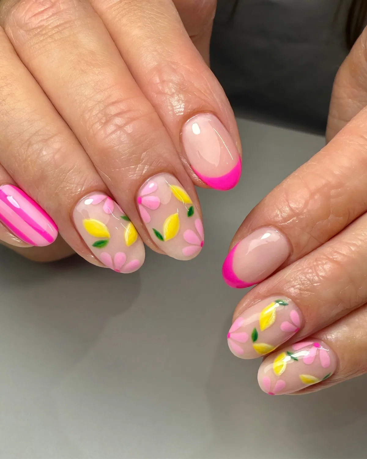Hot-pink French tips with lemon floral accents