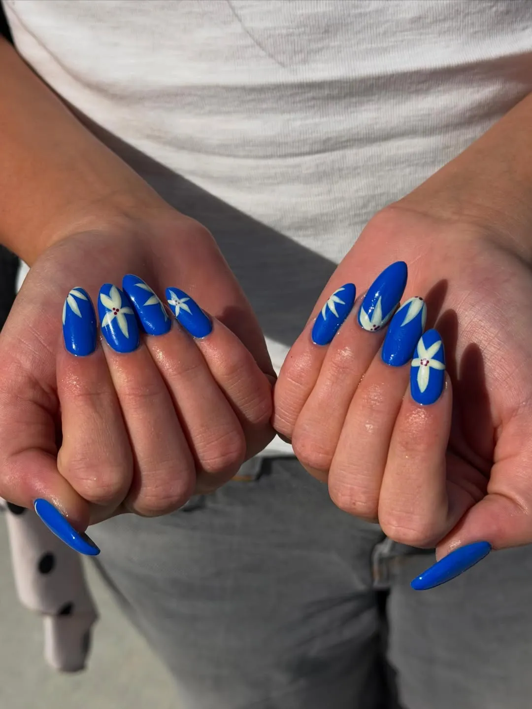Cobalt blue nails with white flowers