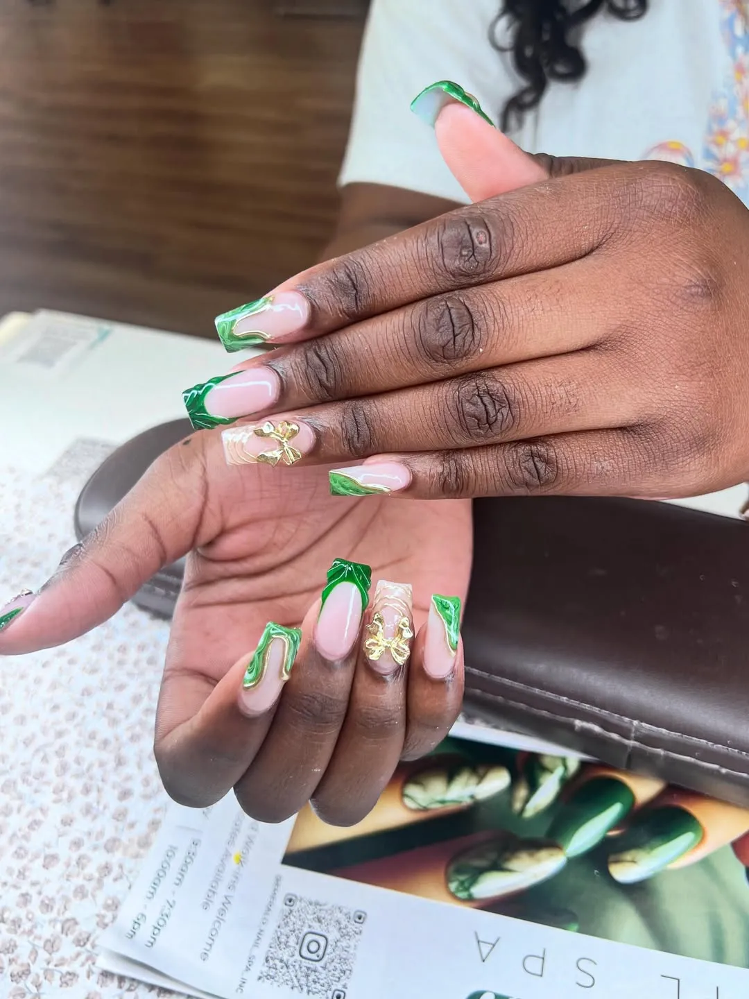 Green swirled tips with gold butterfly accents