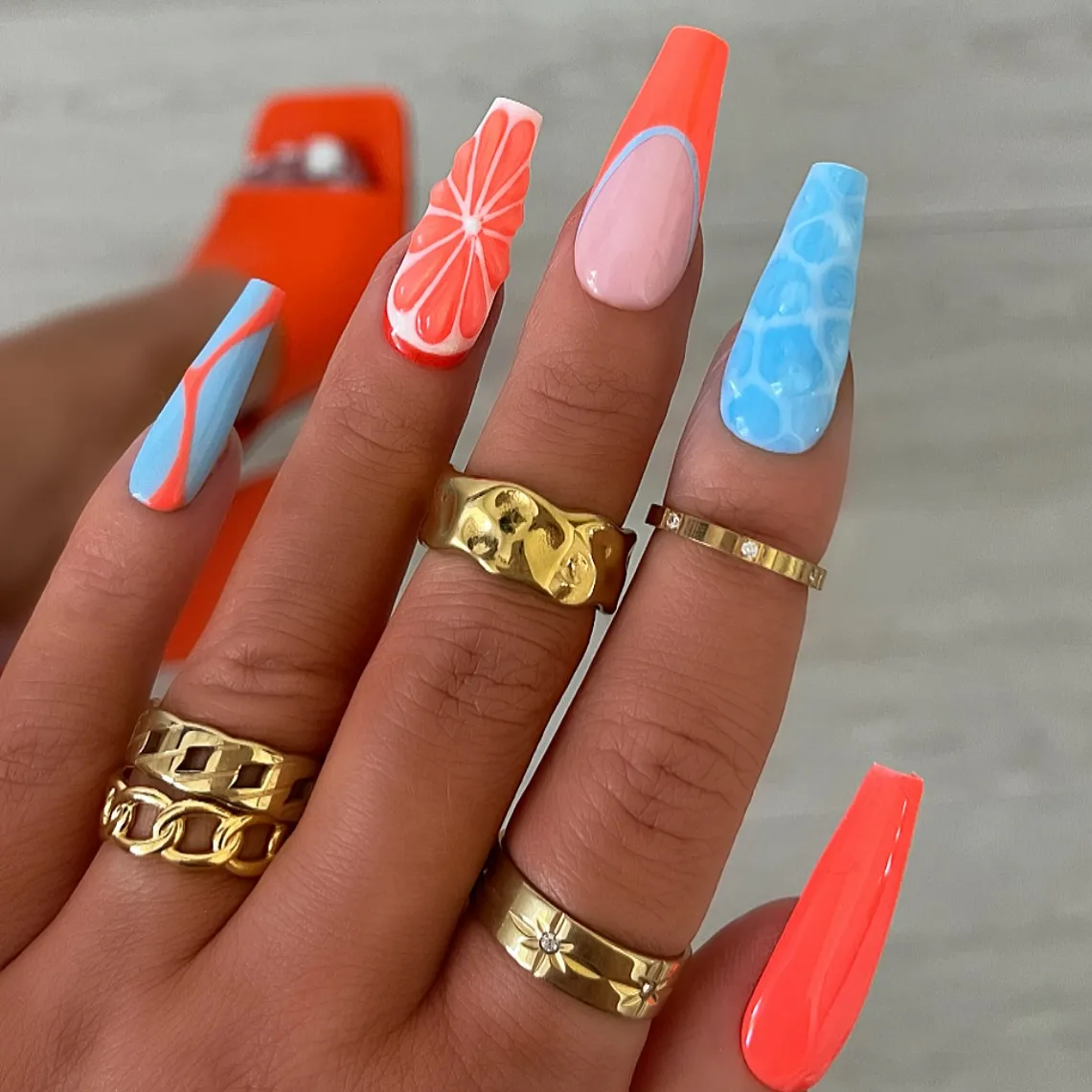 Coral and blue mix with citrus-slice accent