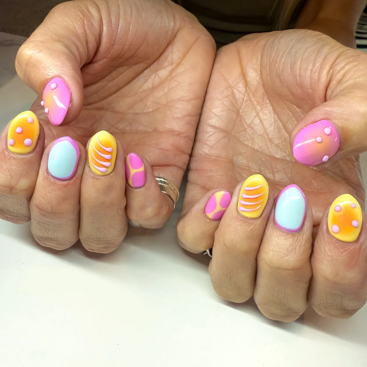 Pastel abstract nails with raised dot accents