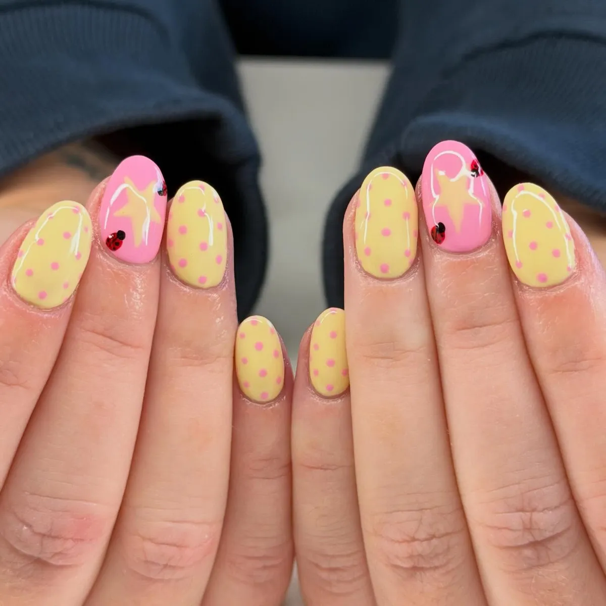 Yellow polka dots with pink star-and-ladybug accents