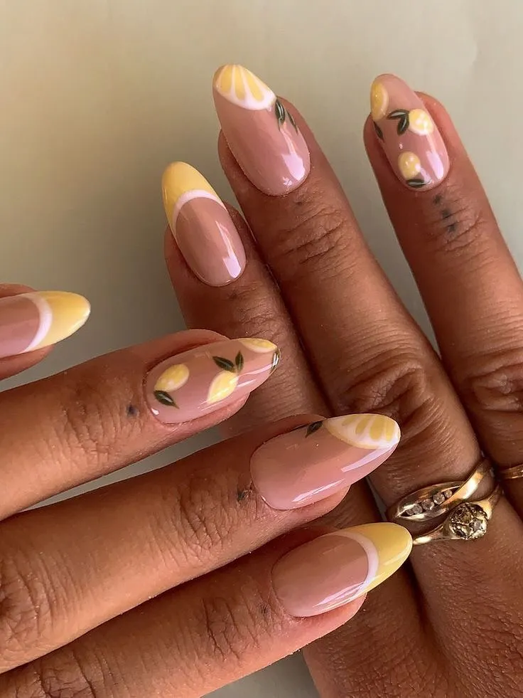 Pink ombré nails with white flower accents