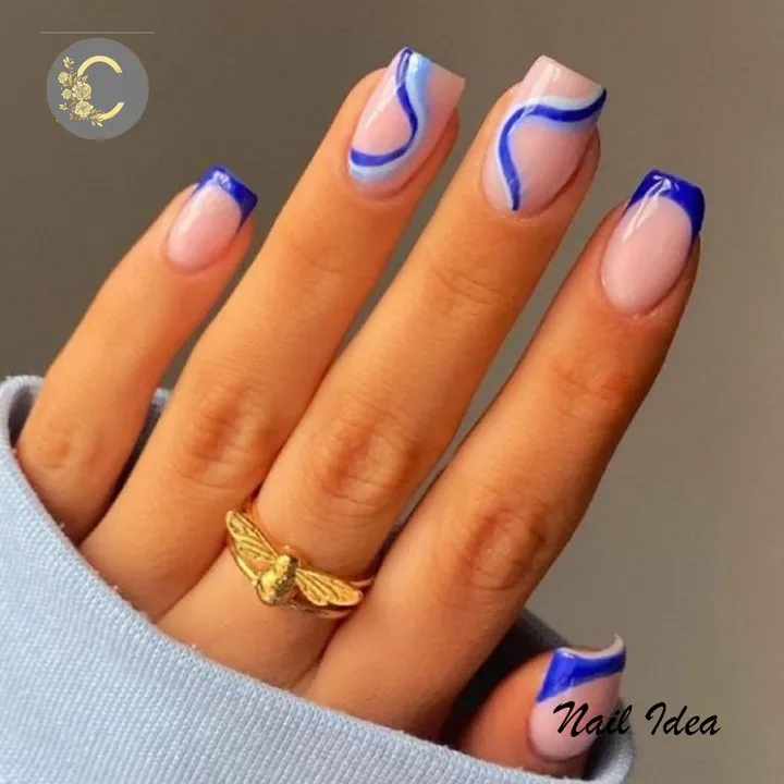Blue French tips with wavy line accents