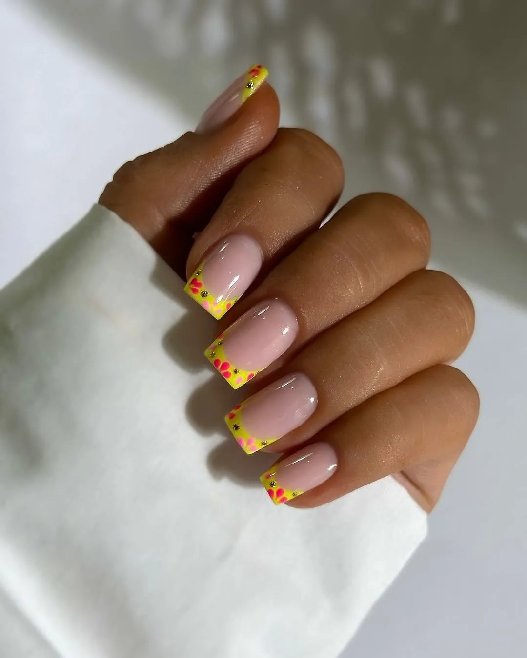 Yellow square French tips with tiny pink flowers