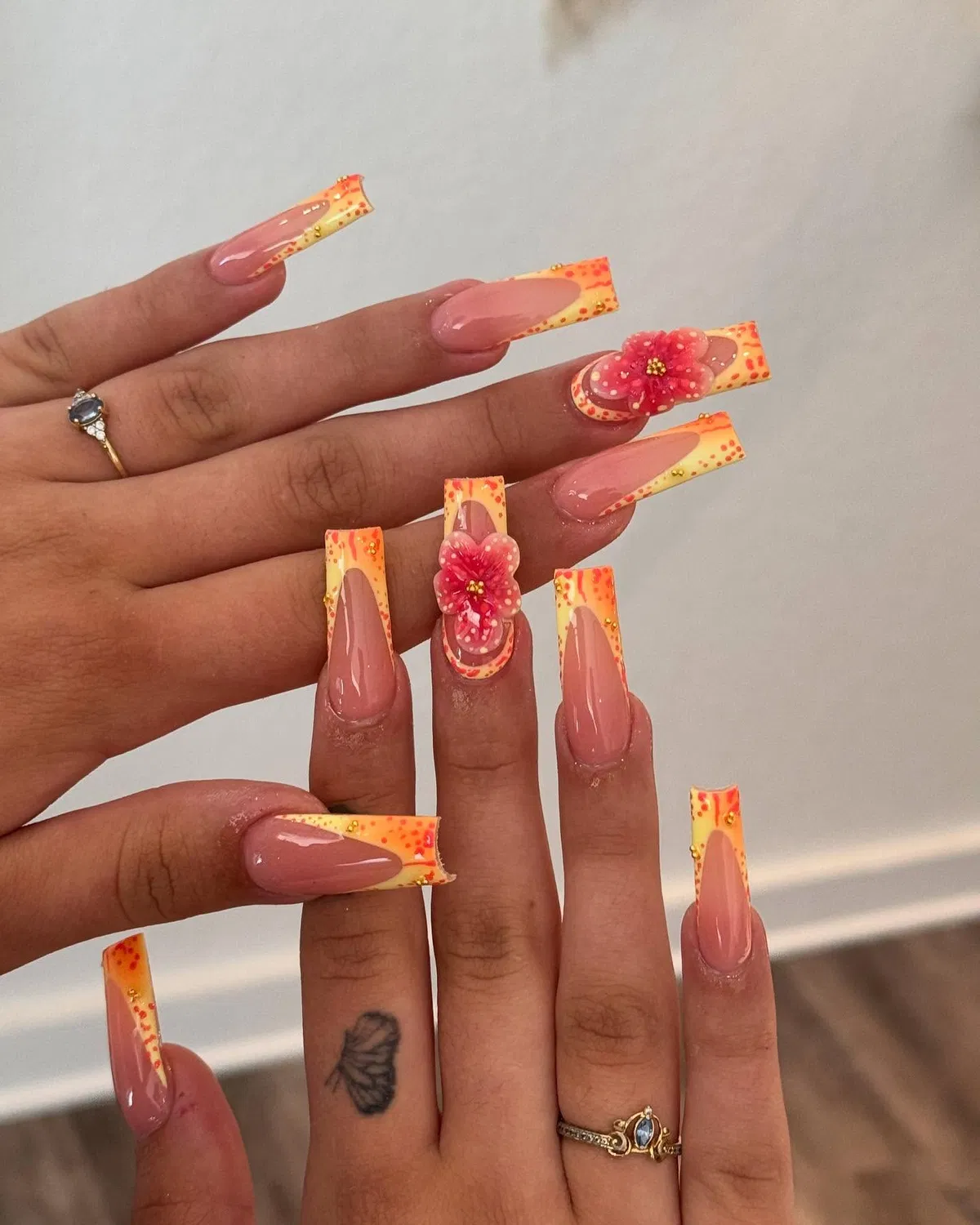 Orange-yellow dotted tips with 3D pink flowers