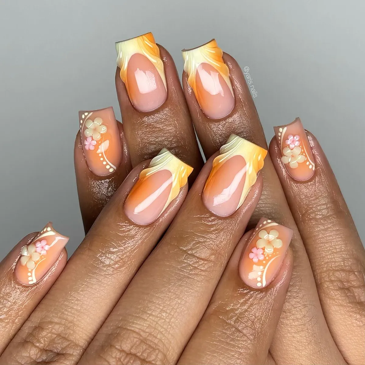 Orange-cream swirled French tips with small florals