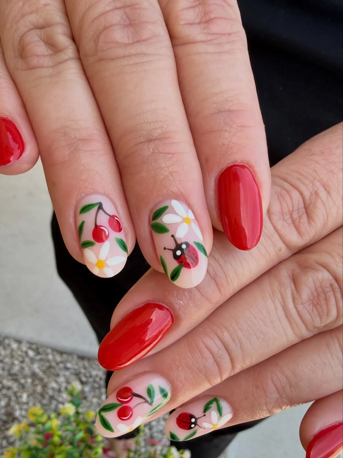 Glossy red with cherries, daisies, and ladybug accents