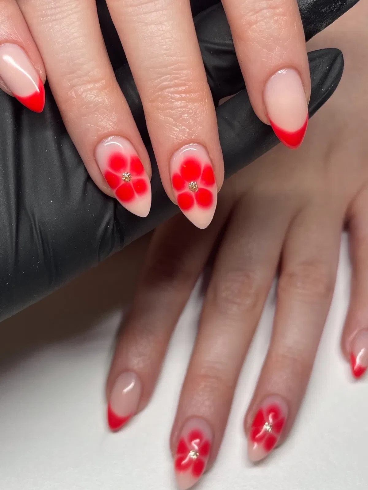 Red French Tips with Bold Red Flower Accents