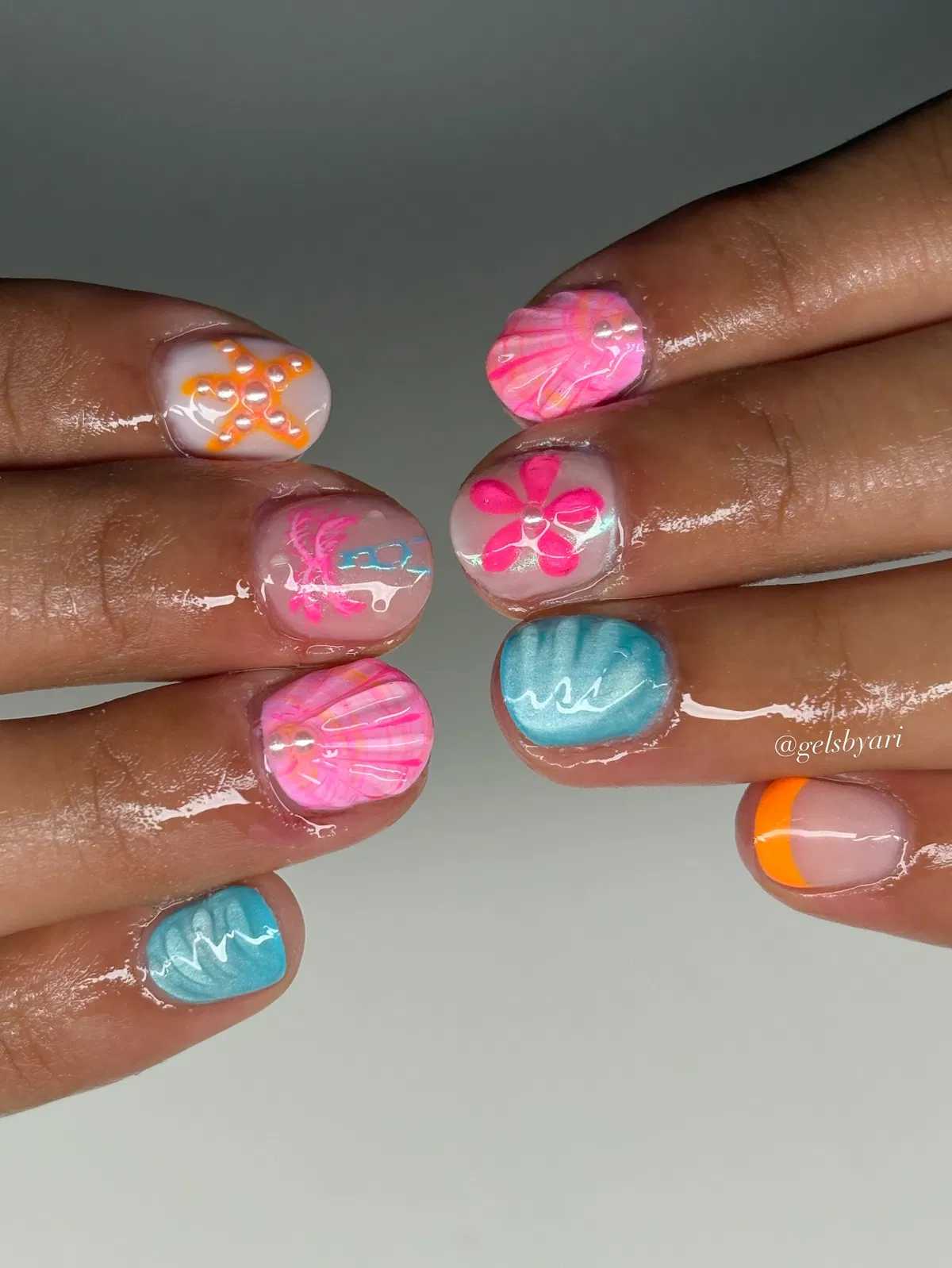 Mixed neon swirls, flower art, and wavy turquoise nails