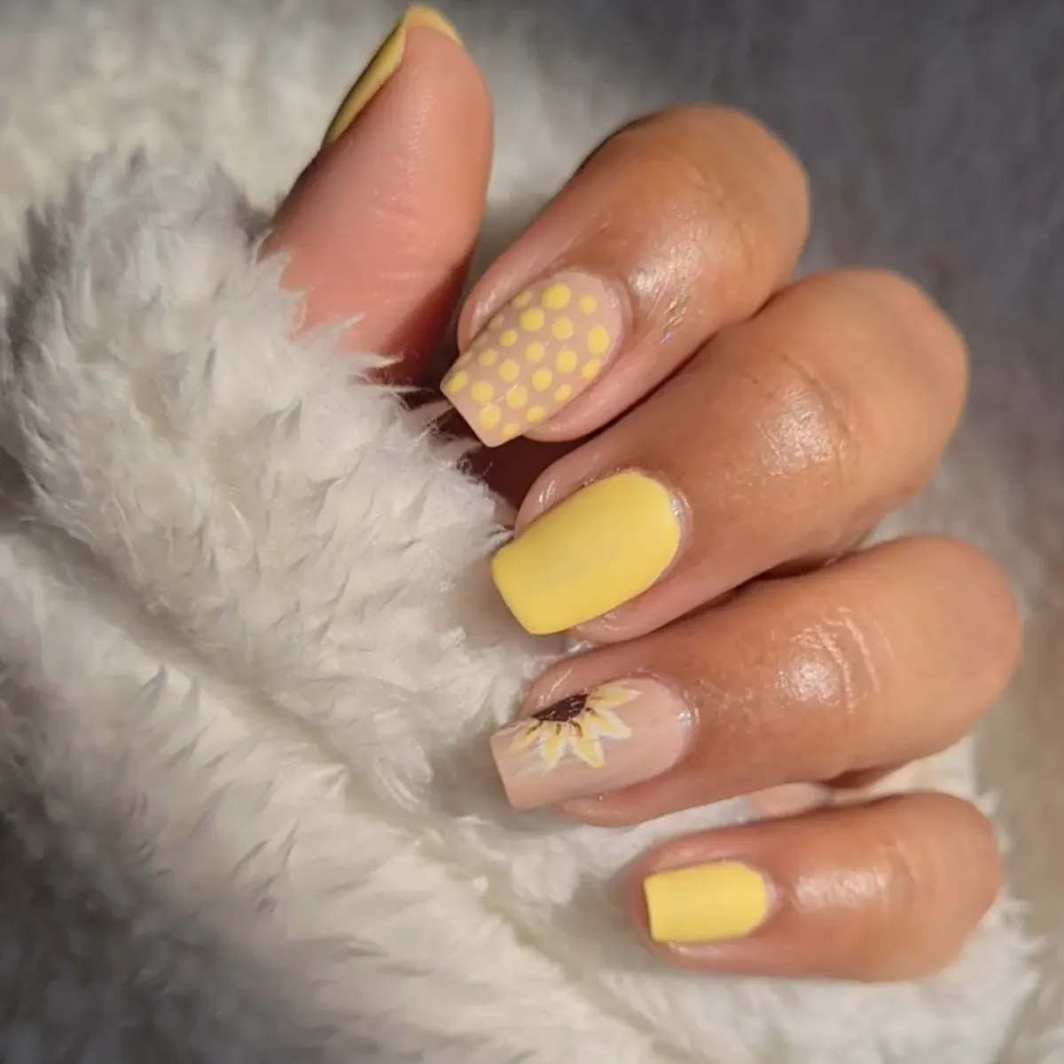Matte pastel yellow with dotted accent and partial sunflower