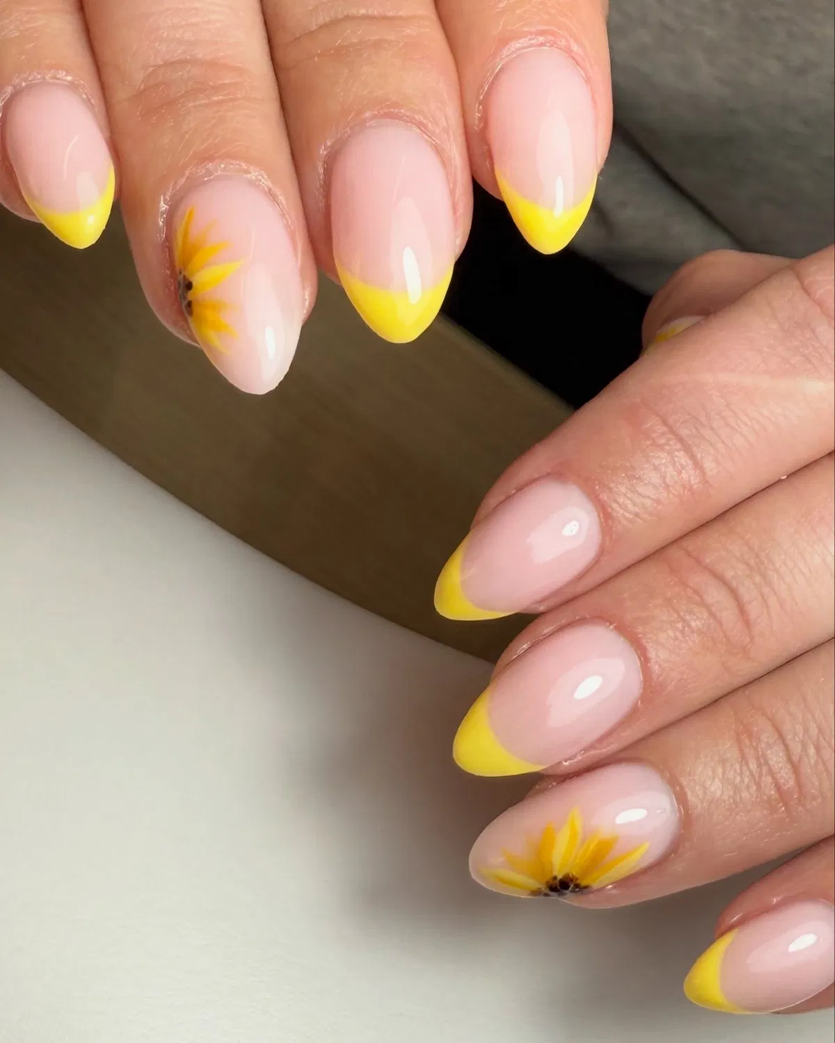 Yellow French tips with subtle sunflower accents