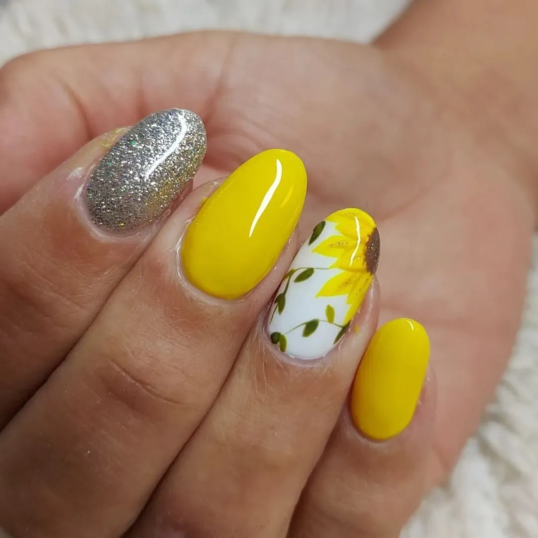 Bright yellow with silver glitter and a white floral accent