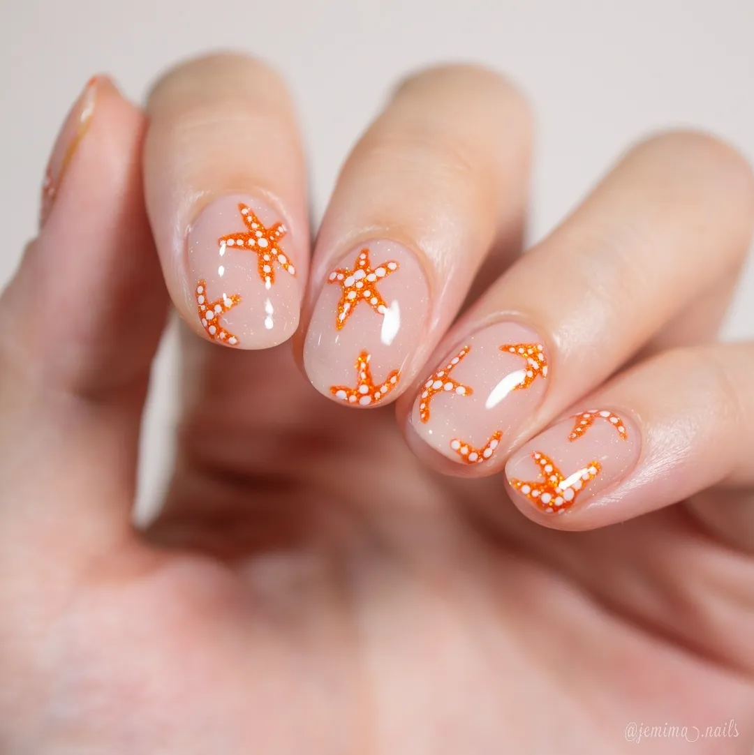 Orange starfish-like motifs on a nude base