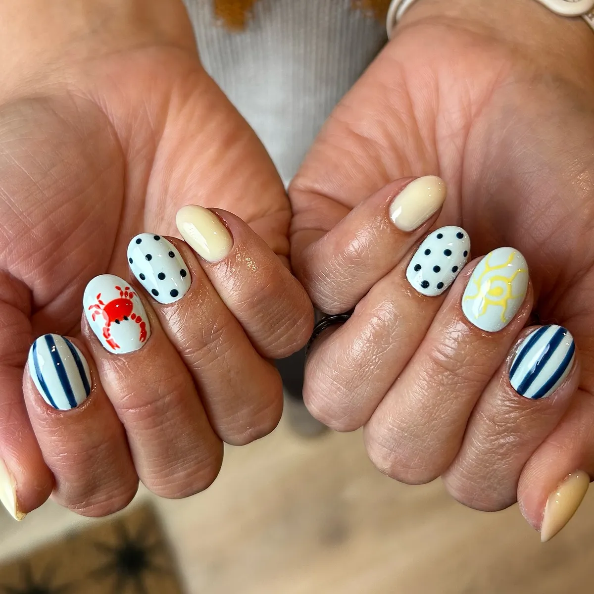 Nautical mix: stripes, polka dots, crab, and yellow sun line art