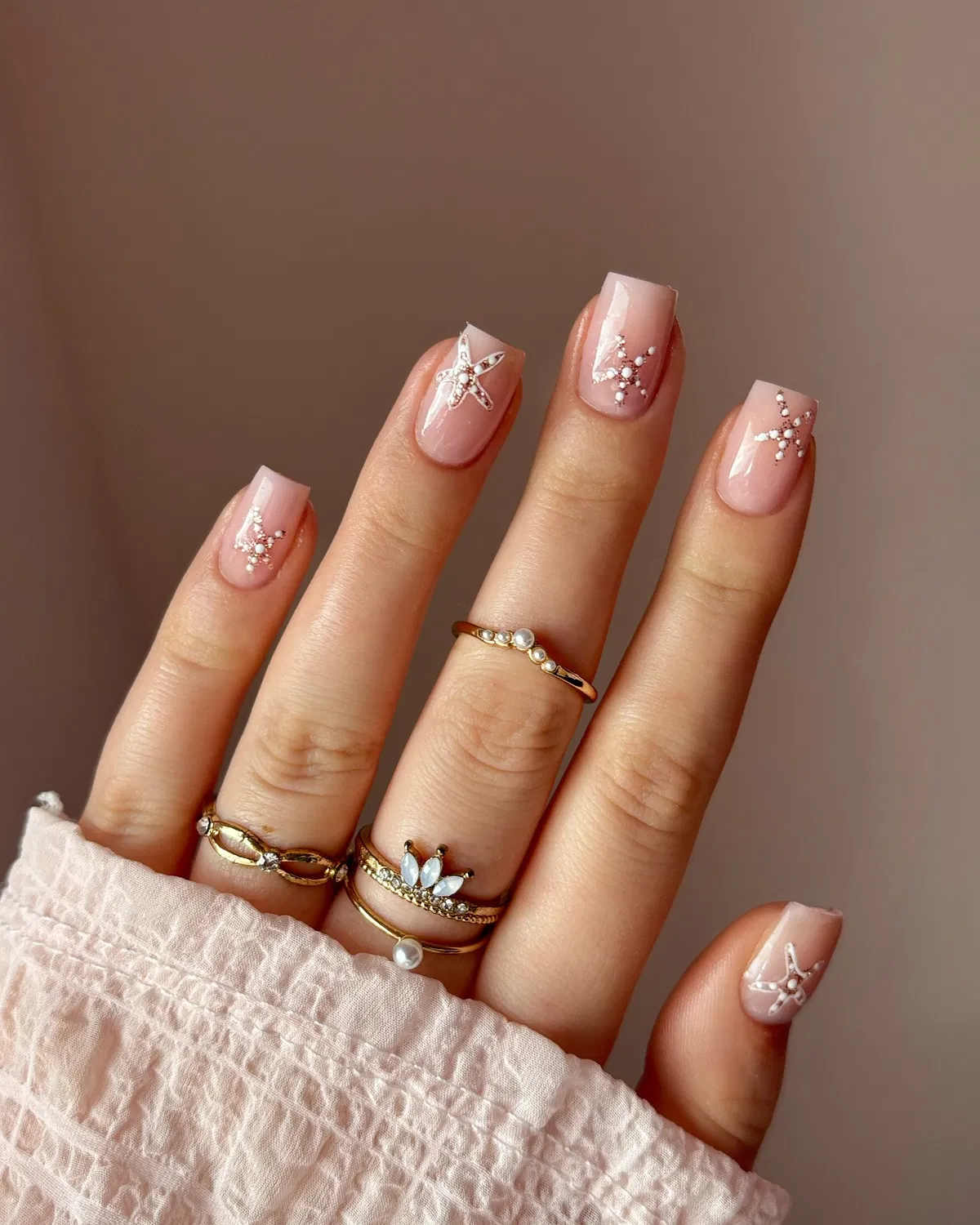Pale pink squares with pearl-style starfish details
