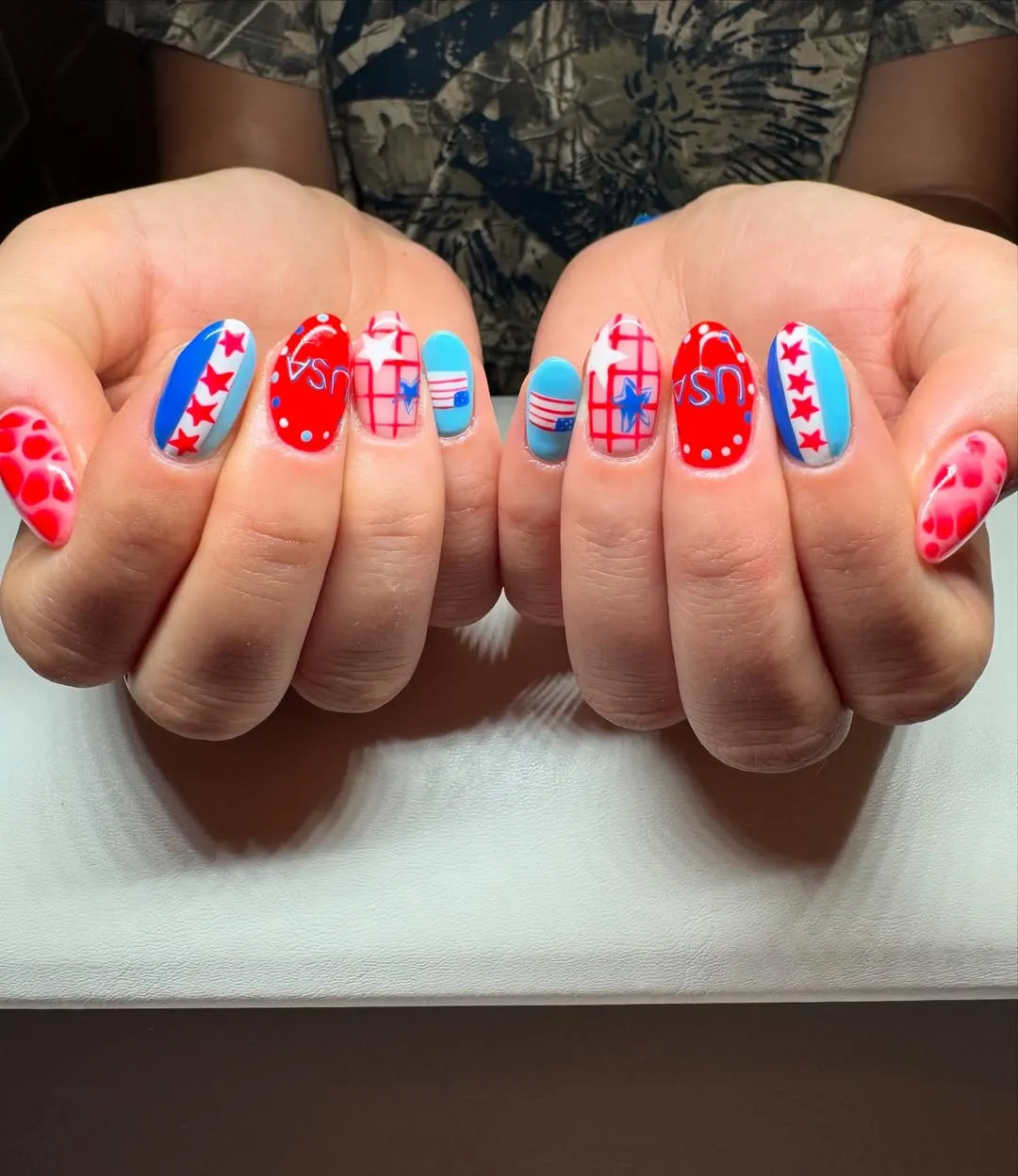 Bold 'USA' lettering with stars, grids, and light-blue accents