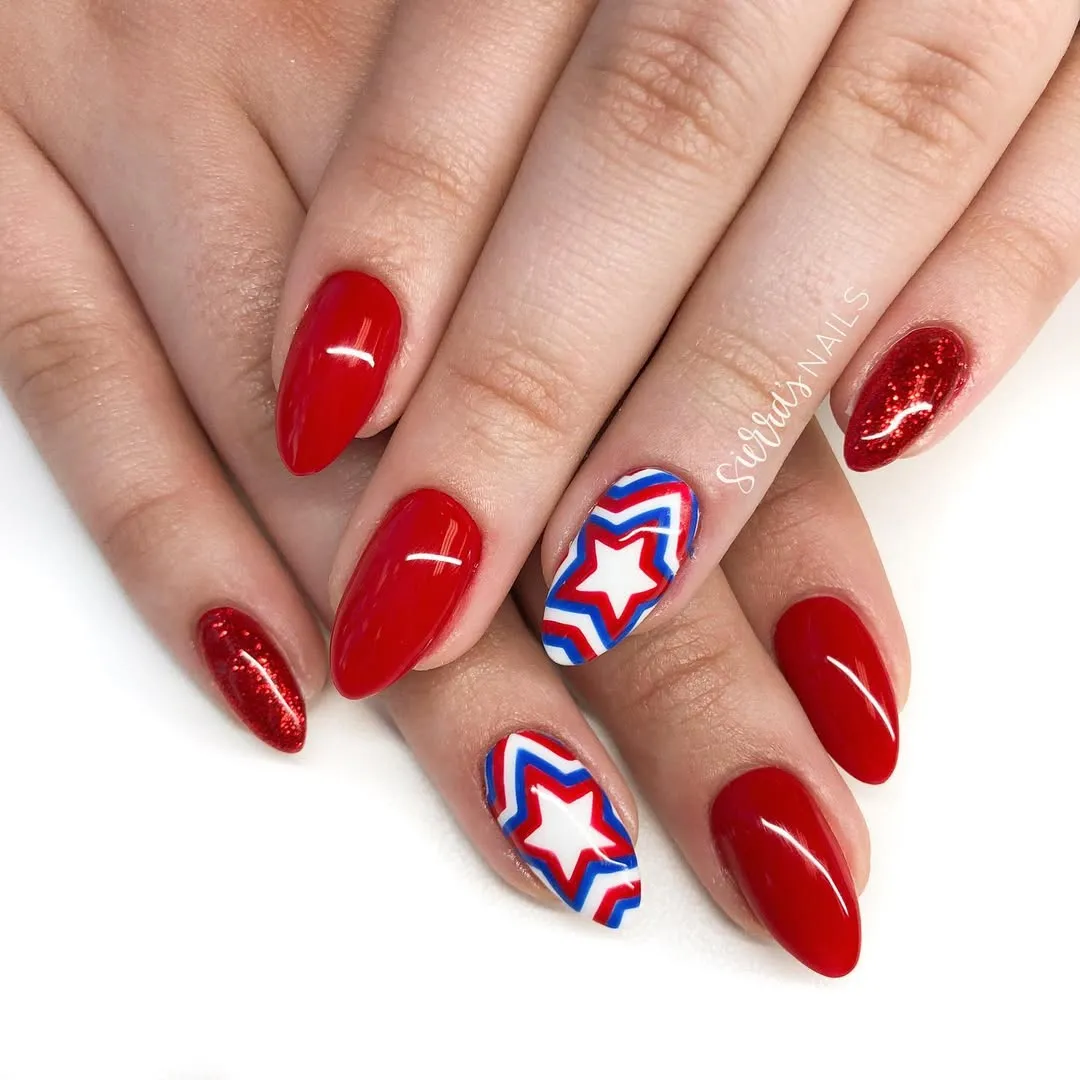 Red glossy set with star-in-chevron accent nails