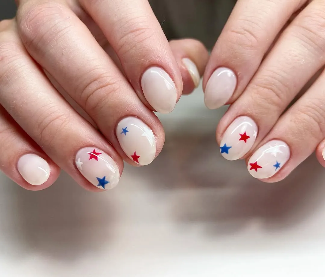 Sheer nude base with tiny red, white, and blue stars