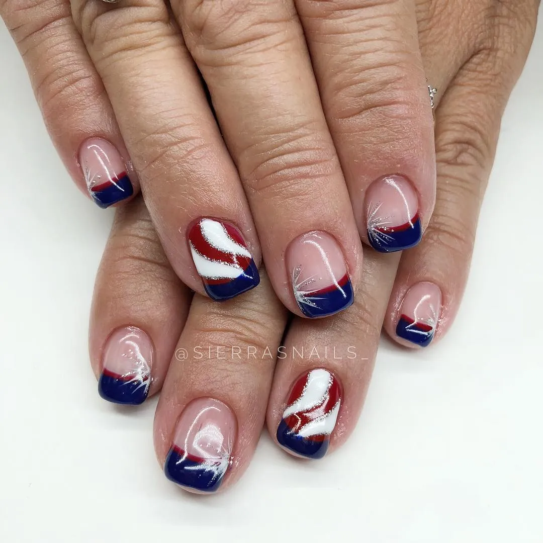 Nude base with blue tips and red-silver accents