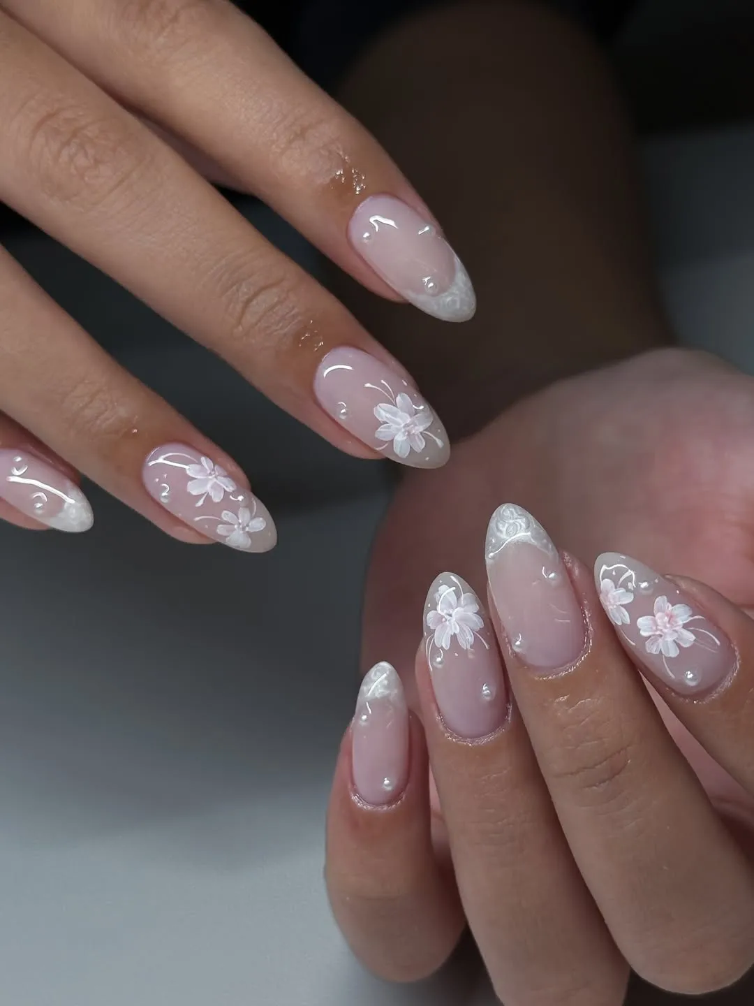 Glossy Pale Pink Nails with White Florals and Clear Droplet Accents