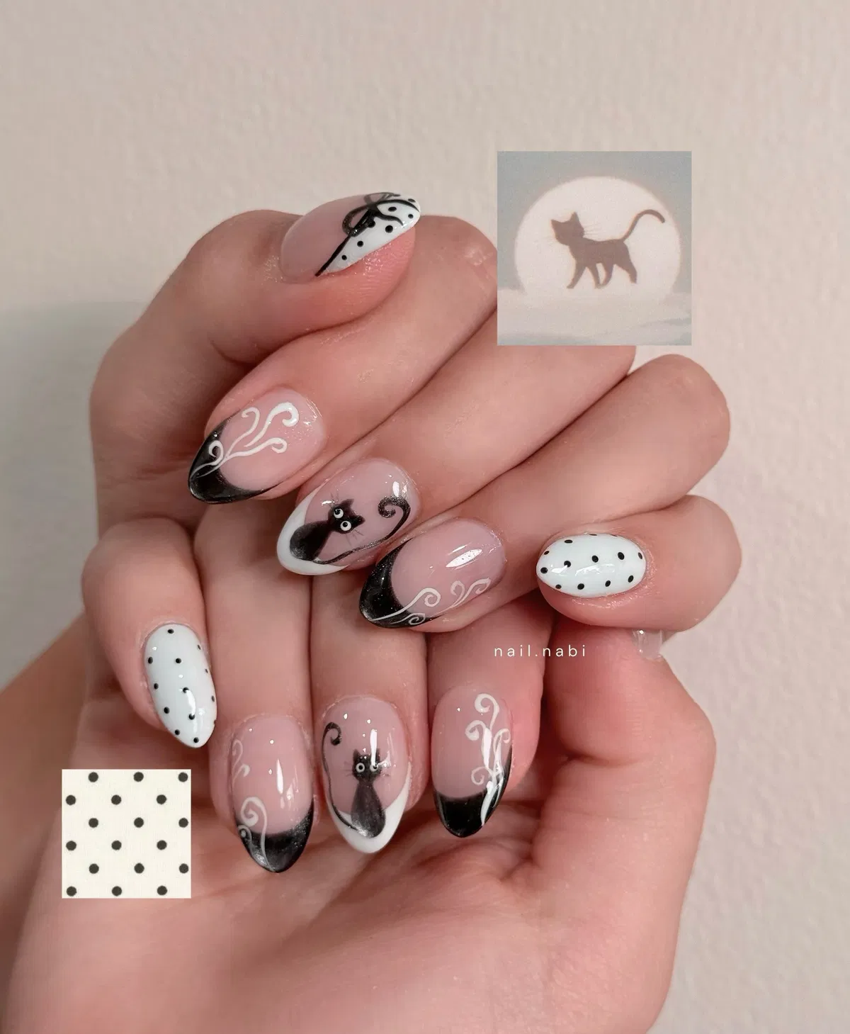 Black French tips with swirls, polka dots, and cat silhouettes