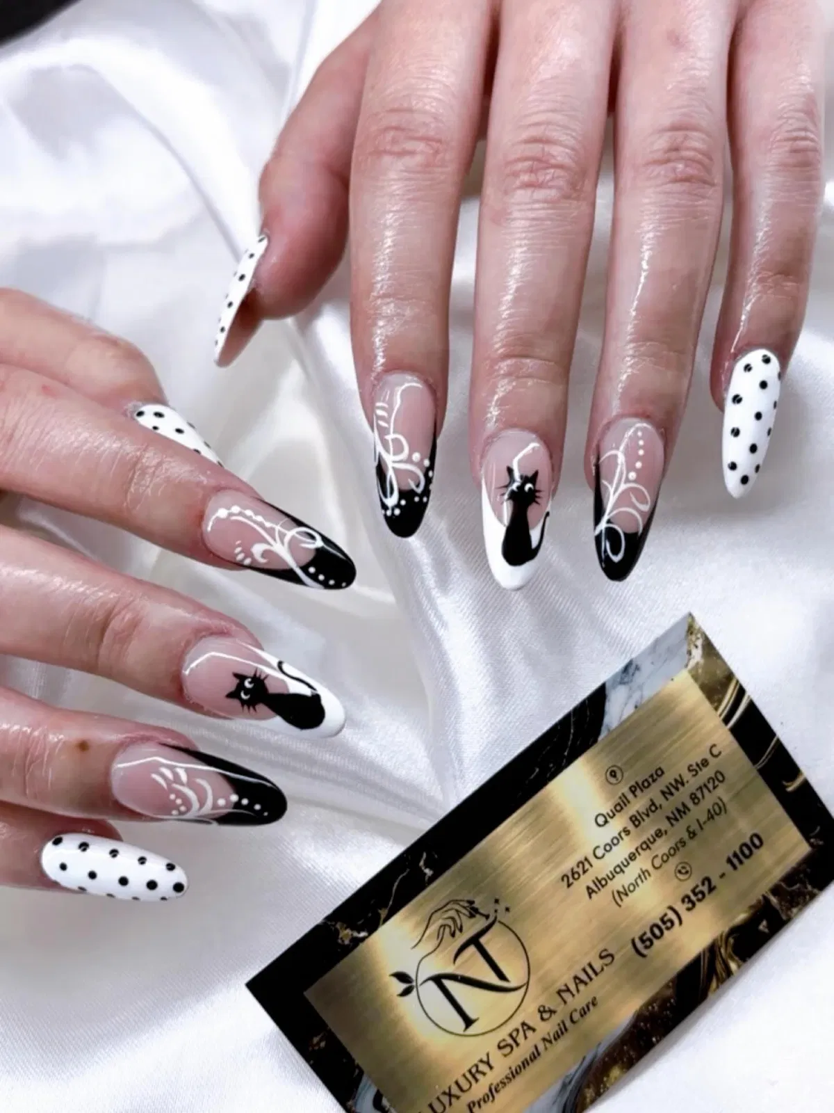 Long graphic tips with polka dots, swirls, and cat silhouettes