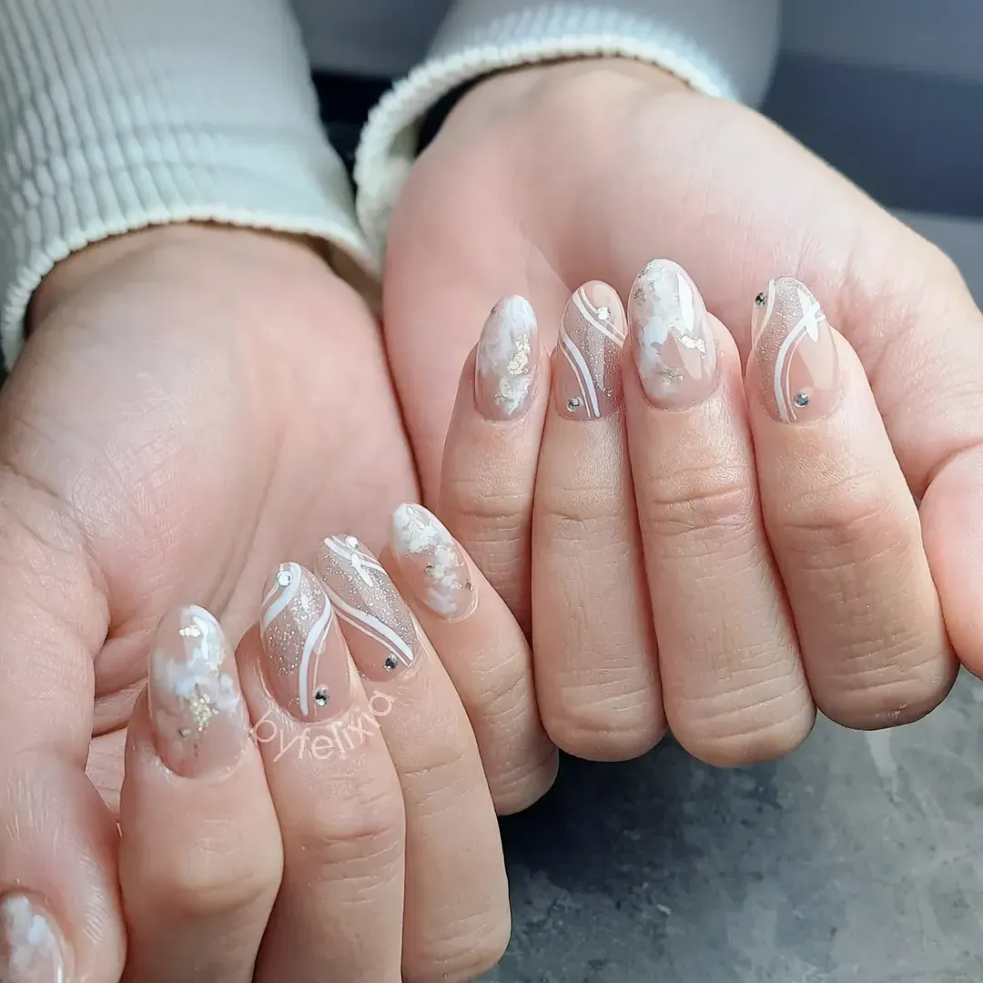 Nude glitter with white swirls and cloudy marble accents