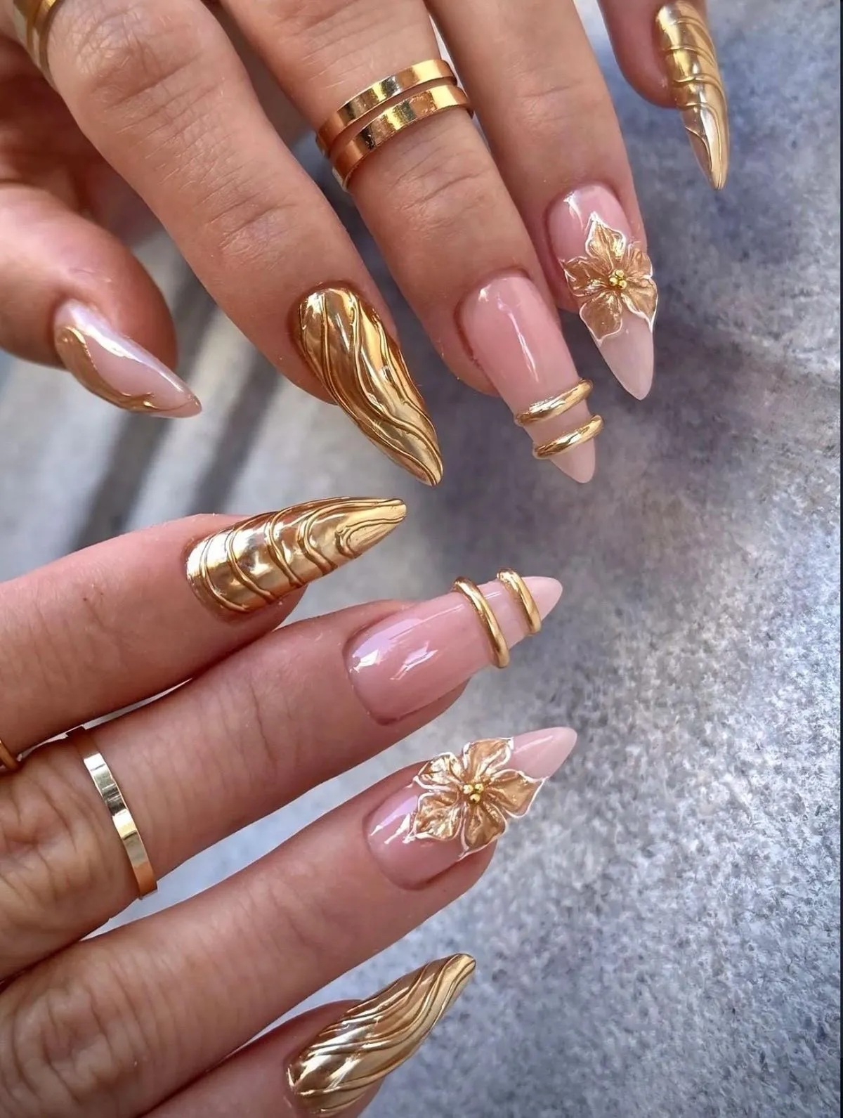 Metallic gold statement nails with raised florals