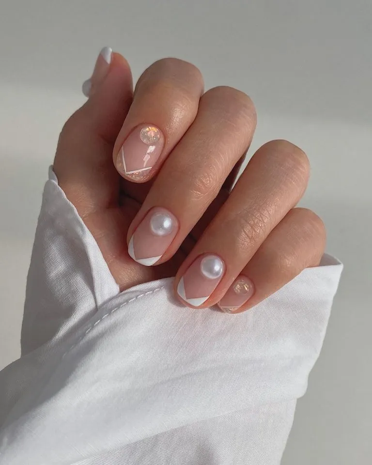 Short angled French tips with pearl-like domes