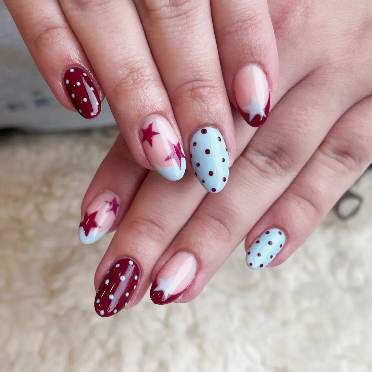 Pale blue polka dots with burgundy star accents