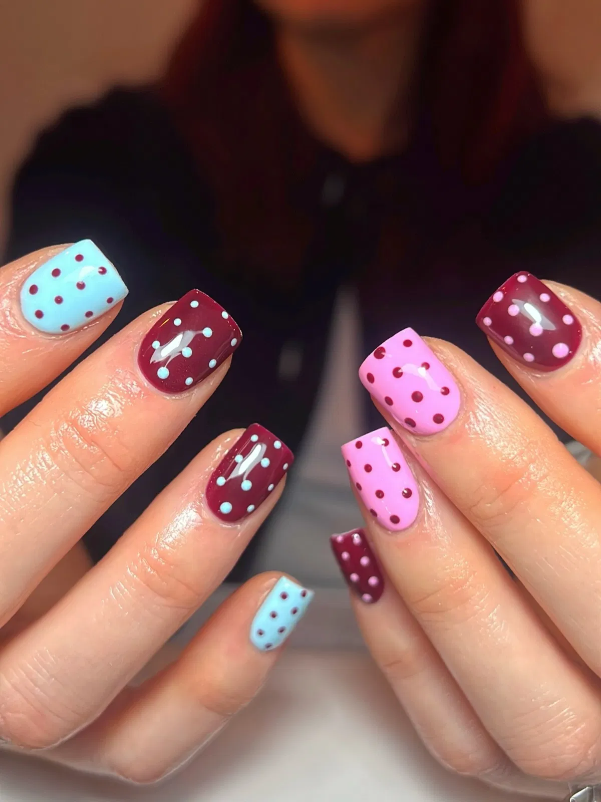 Colorful polka dots with burgundy, pink, and blue