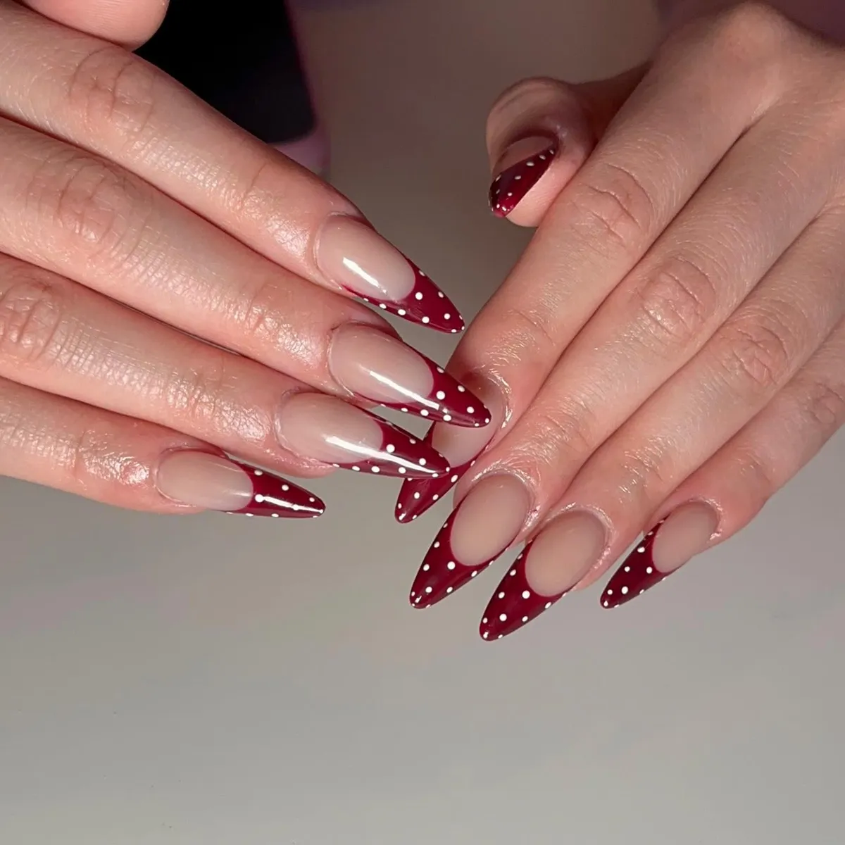 Extra-long stiletto French tips with white polka dots