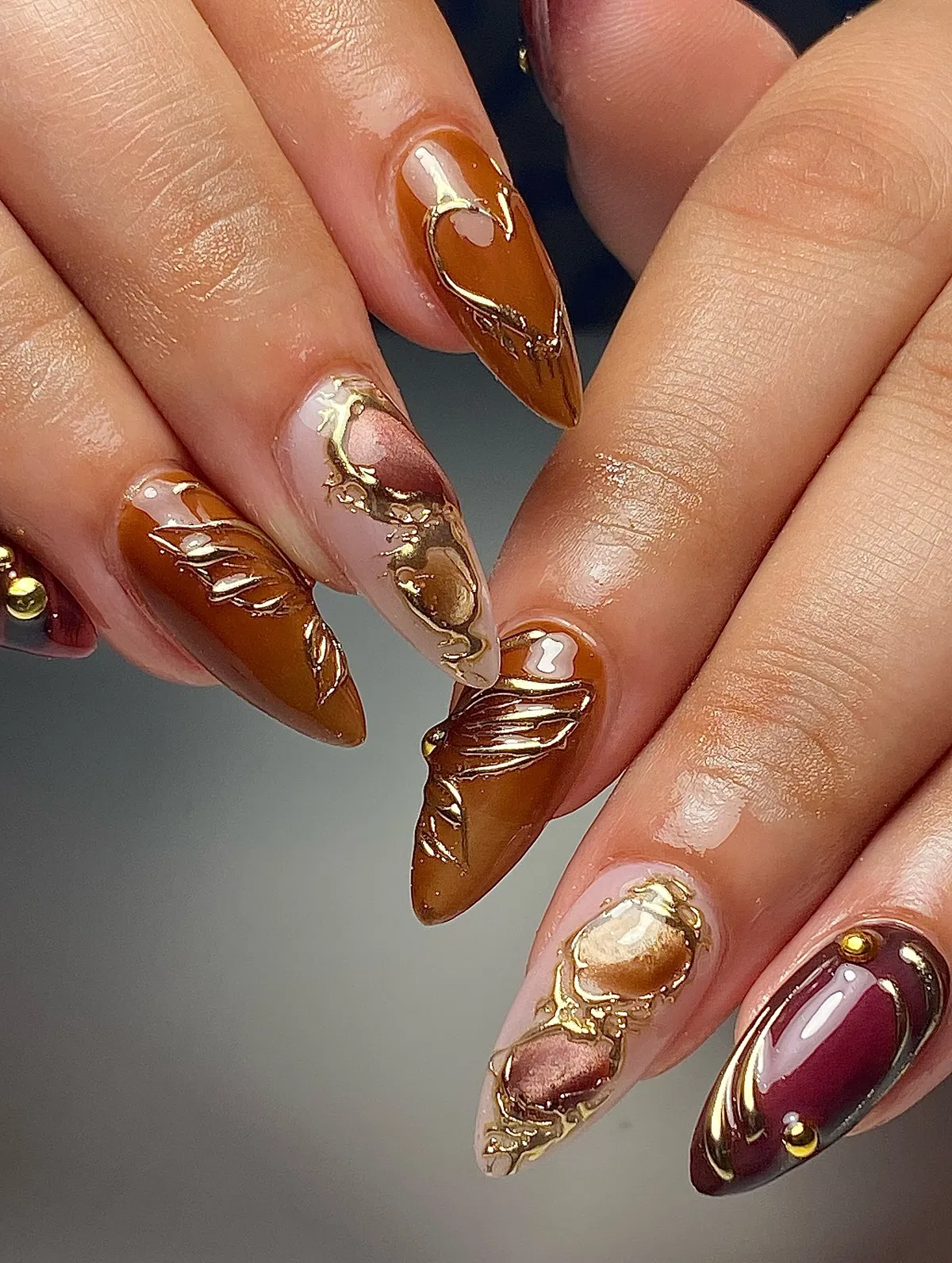Long burnt tones with raised gold embellishments