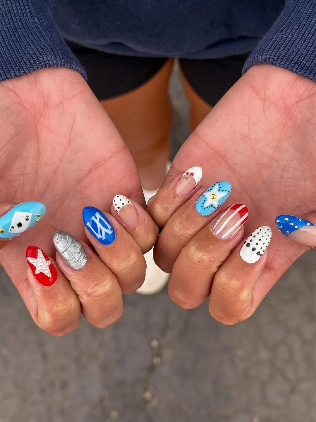 Eclectic mix: metallic silver, pearls, card symbols, and studs