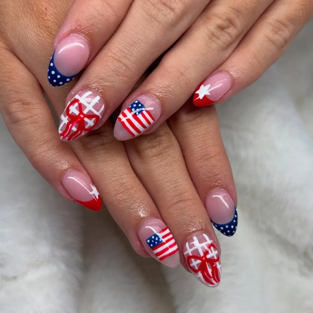Sheer base French tips with dots, stars, and mini flag accents