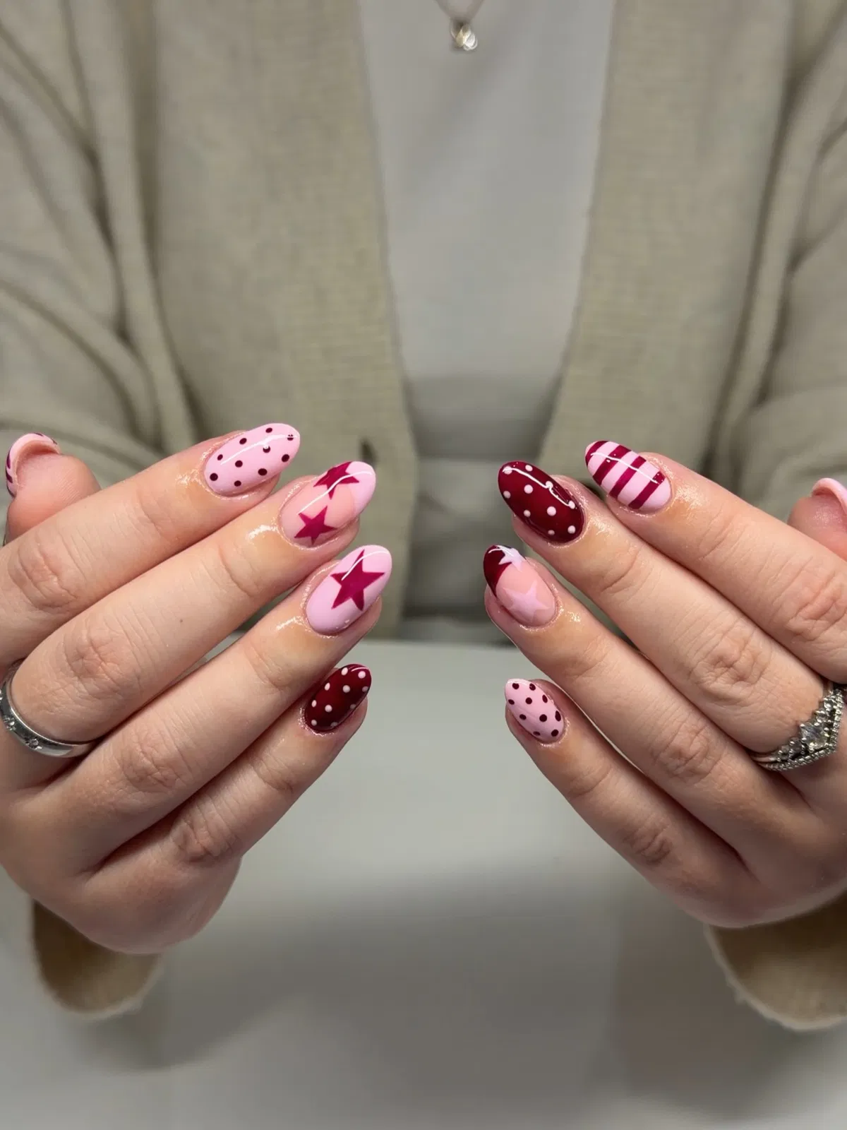 Mixed patterns: polka dots, stars, and stripes in pink and burgundy